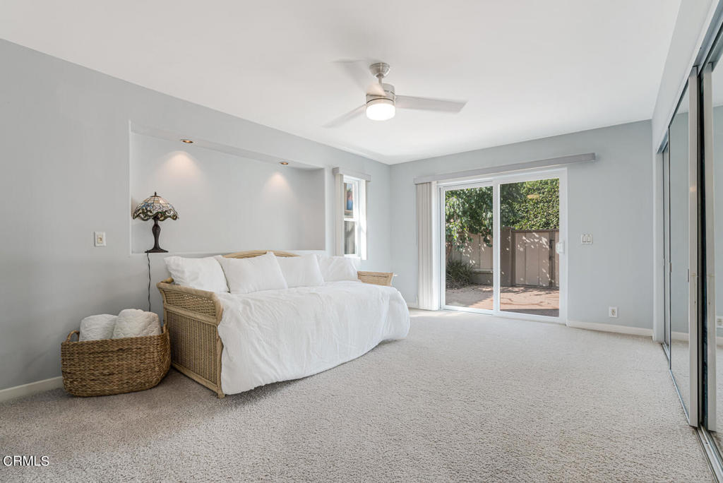 5331 Wavecrest Way Oxnard, CA 93035 - Photo 47 of 60 a spacious bedroom with a bed and a chandelier