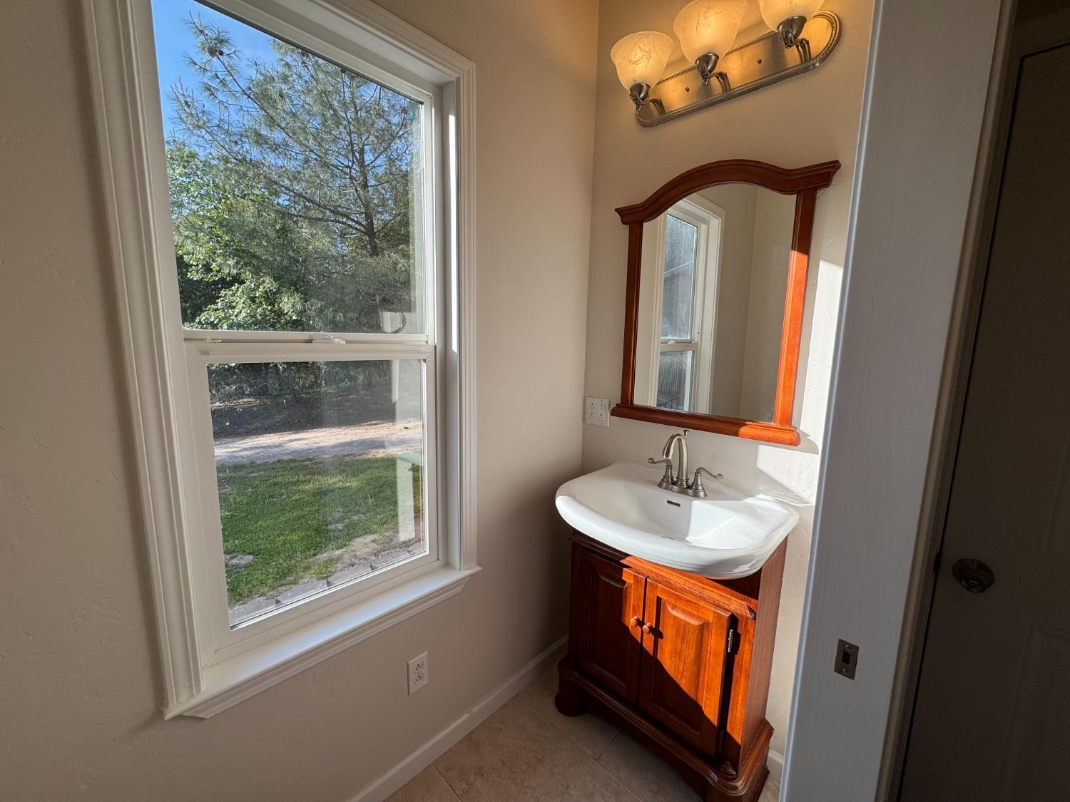 10095 Birchville Road Nevada City, CA 95959 - Photo 34 of 38 a bathroom with a sink and a mirror