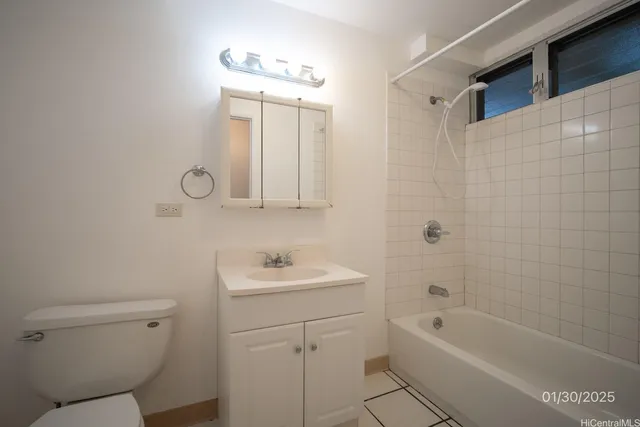 a bathroom with a toilet sink a mirror a bathtub and shower