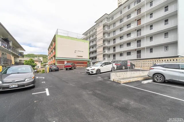 a view of a city street with cars