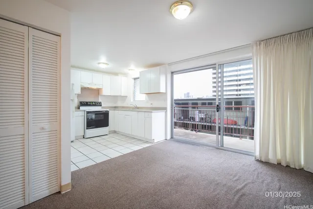 a view of kitchen with cabinets and wooden floor