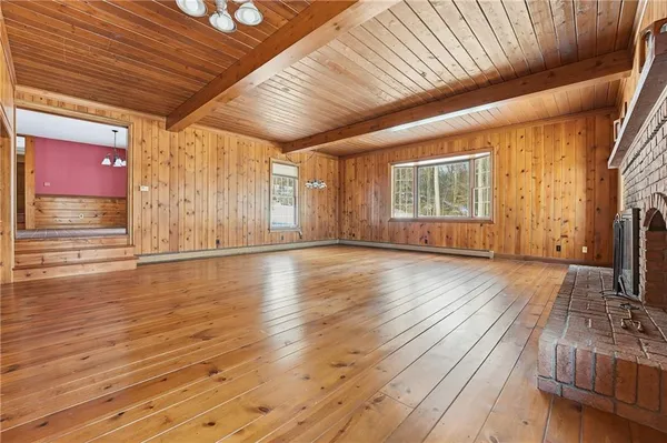 a view of a livingroom with wooden floor