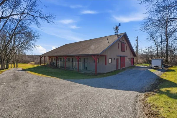 a view of house with yard
