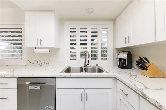 a kitchen with a sink and a window