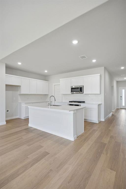 1472 Companero Street Haslet, TX 76052 - Photo 12 of 40 a view of kitchen with wooden floor