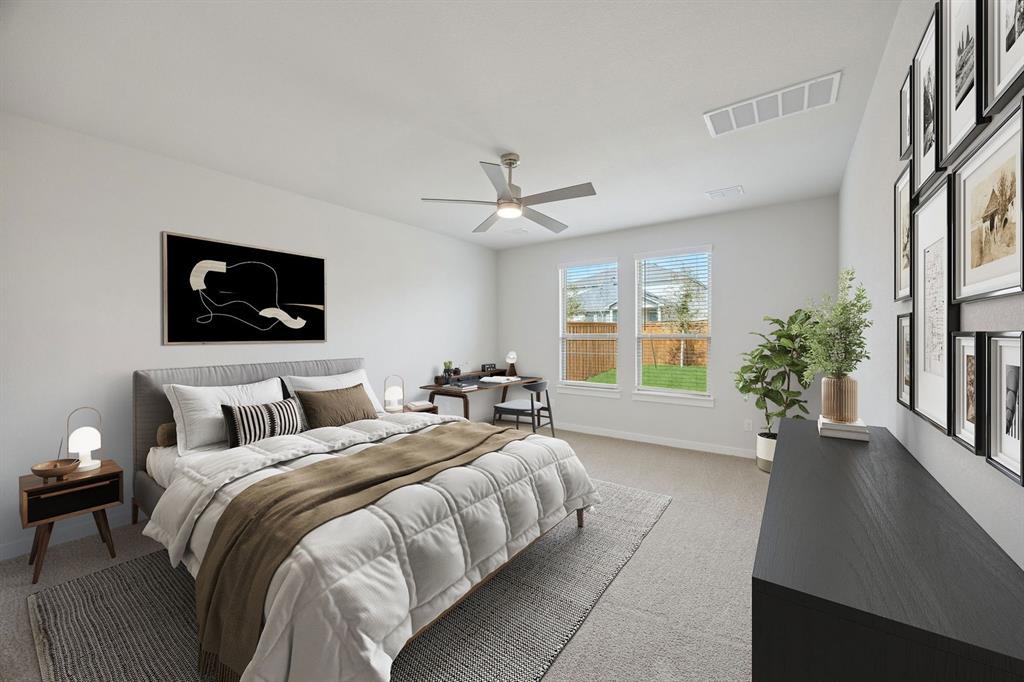 1472 Companero Street Haslet, TX 76052 - Photo 16 of 40 a bed room with a bed mirror and a window