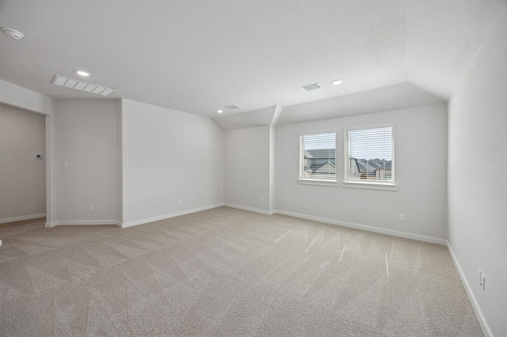 1472 Companero Street Haslet, TX 76052 - Photo 24 of 40 a view of an empty room with a window