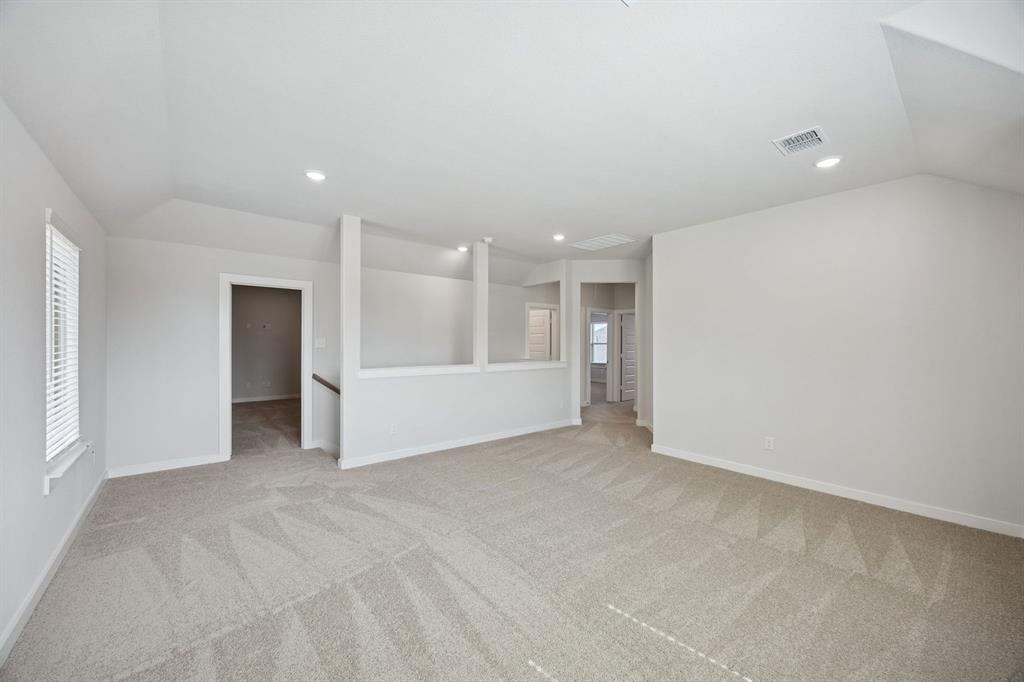 1472 Companero Street Haslet, TX 76052 - Photo 25 of 40 a view of an empty room with a cabinet and a window