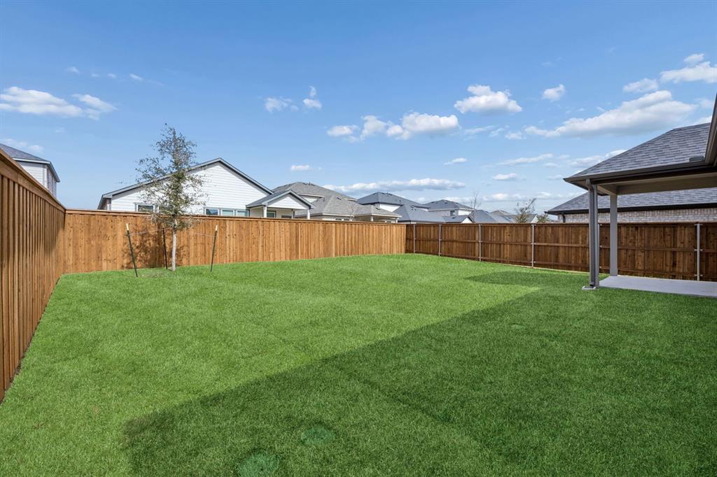 1472 Companero Street Haslet, TX 76052 - Photo 35 of 40 a view of an house with backyard and garden