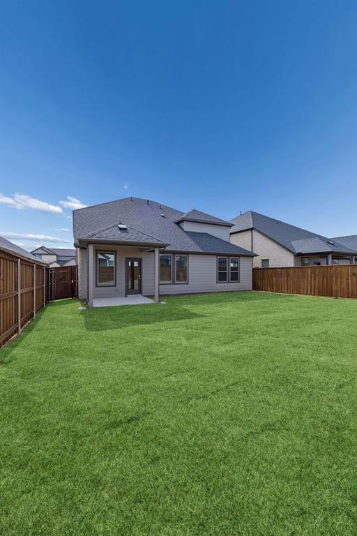 1472 Companero Street Haslet, TX 76052 - Photo 37 of 40 a front view of a house with a yard