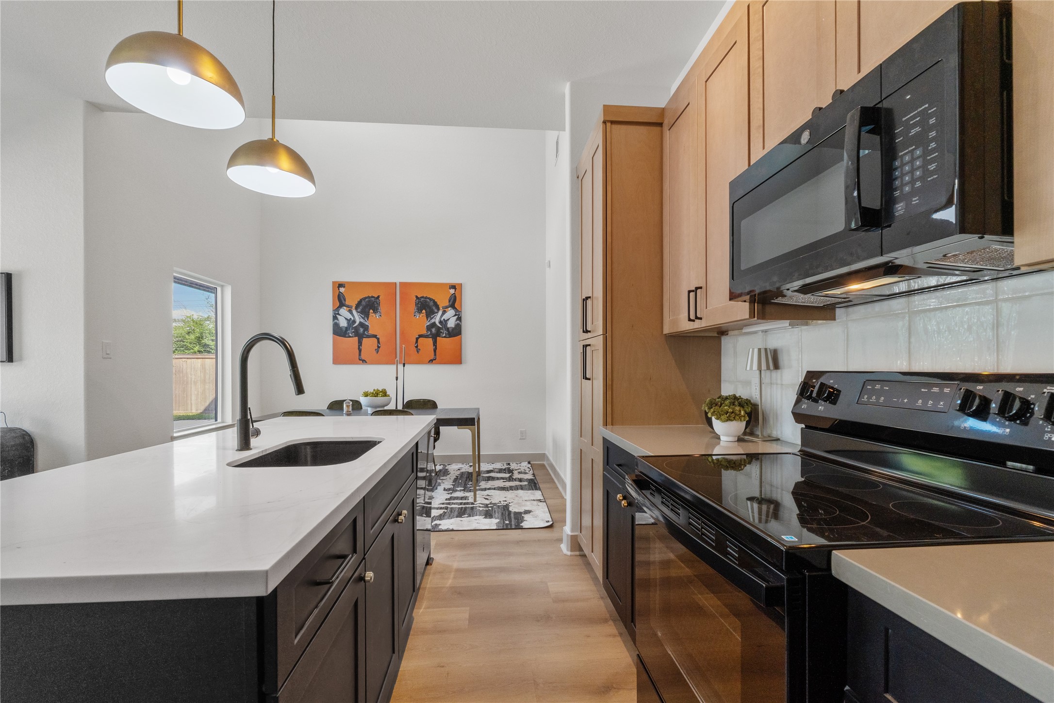 4214 Clover Street Houston, TX 77051 - Photo 15 of 25 a kitchen with stainless steel appliances granite countertop a stove a sink and a microwave