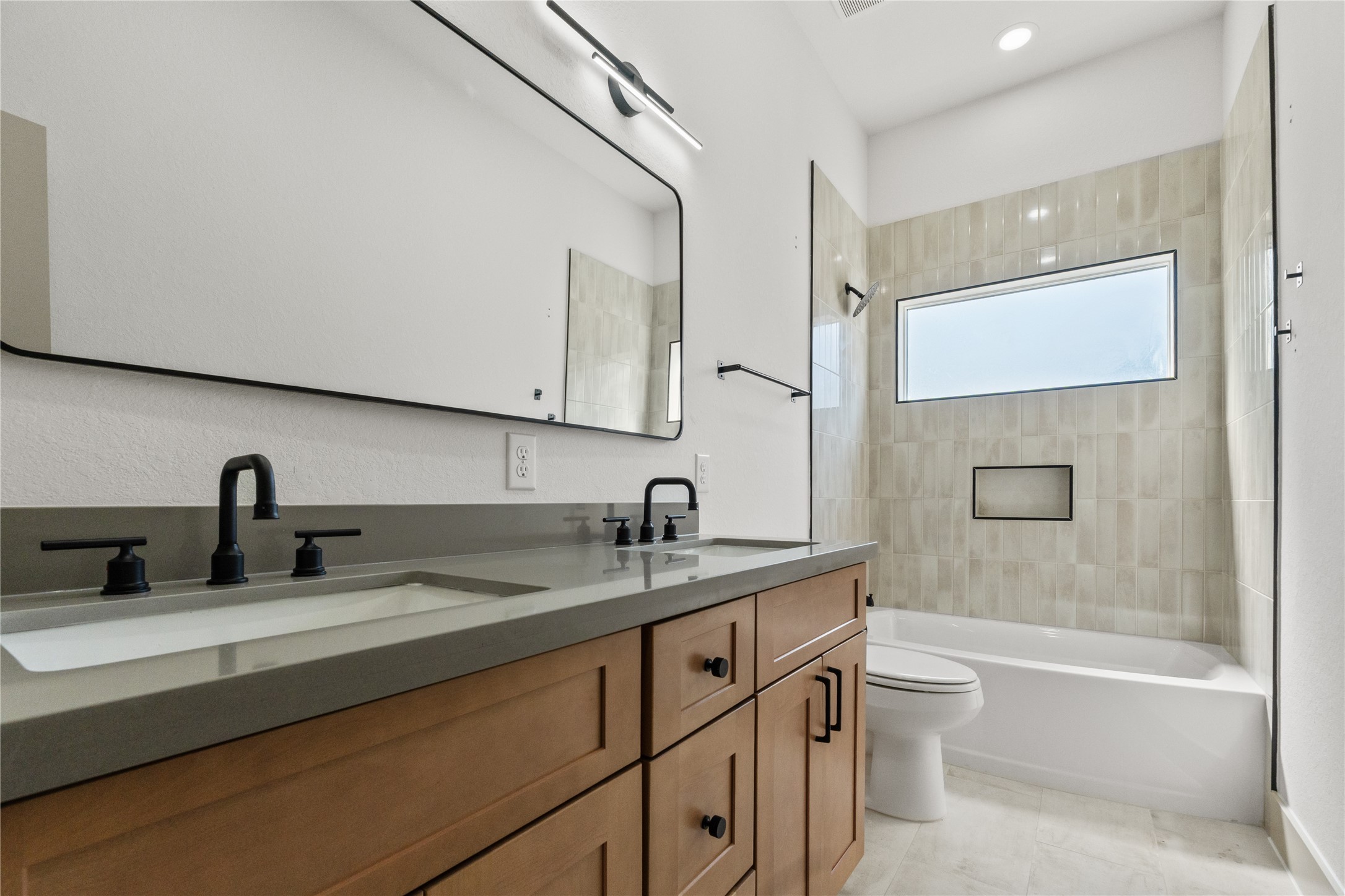 4214 Clover Street Houston, TX 77051 - Photo 20 of 25 a bathroom with a granite countertop sink toilet and mirror