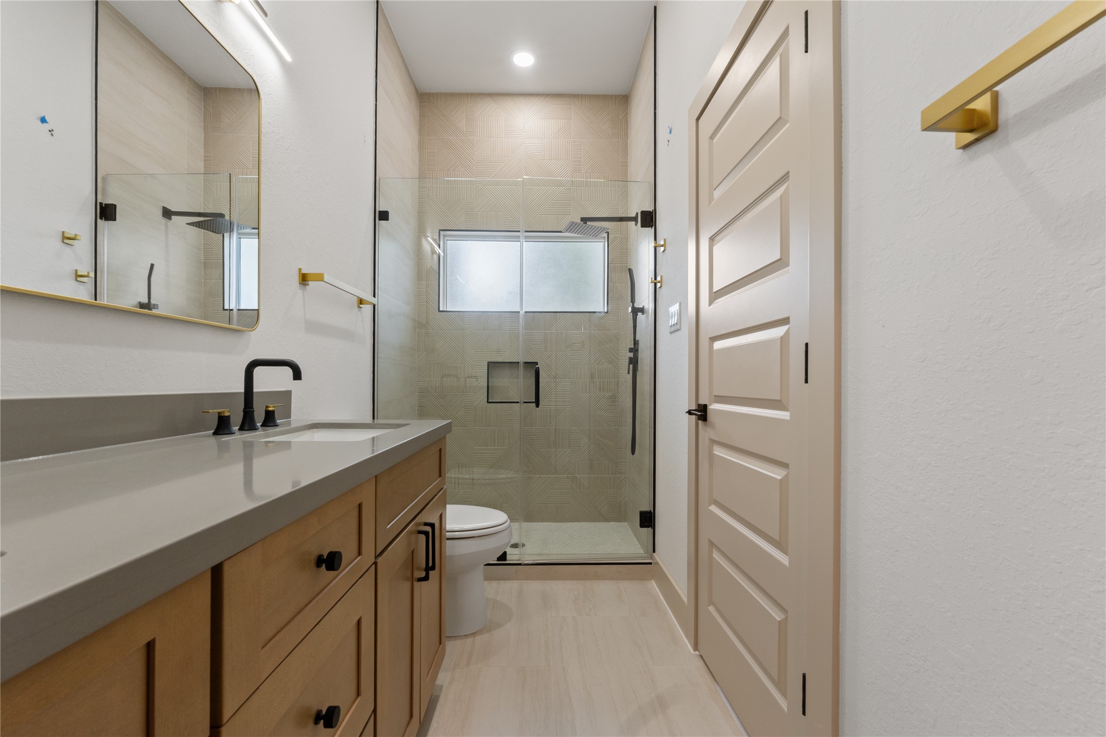 4214 Clover Street Houston, TX 77051 - Photo 23 of 25 a view of a bathroom with a sink and mirror
