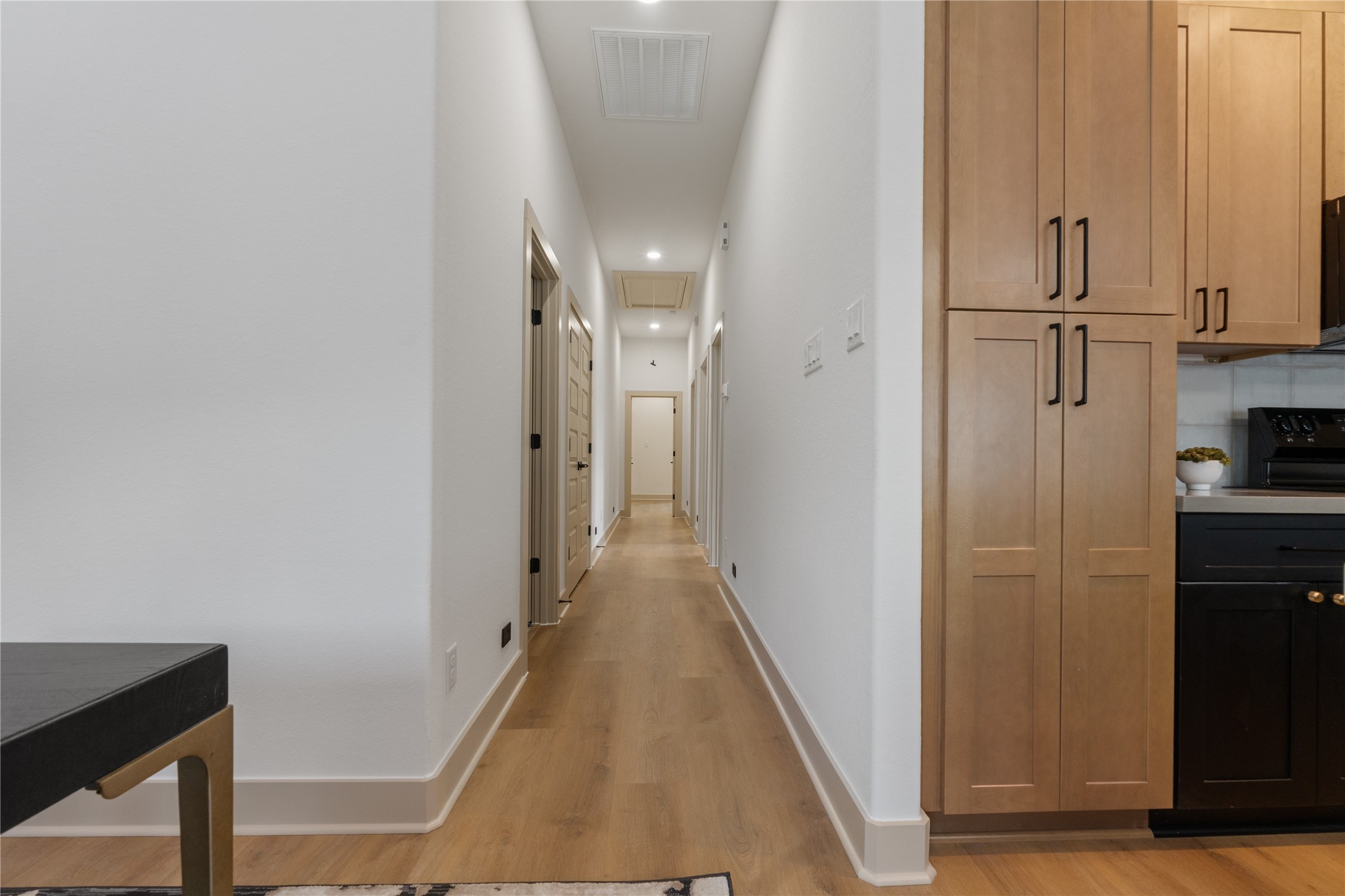 4214 Clover Street Houston, TX 77051 - Photo 24 of 25 a view of a hallway with wooden floor and staircase