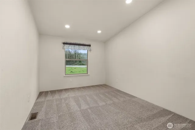 a bathroom with a granite countertop sink a toilet and shower