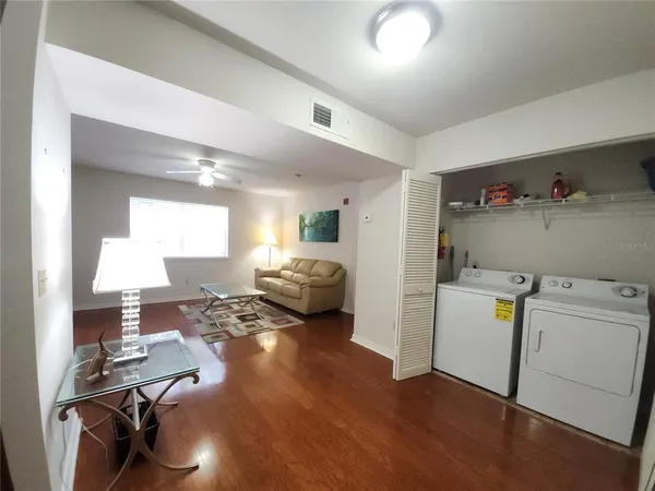 a workspace with furniture and wooden floor