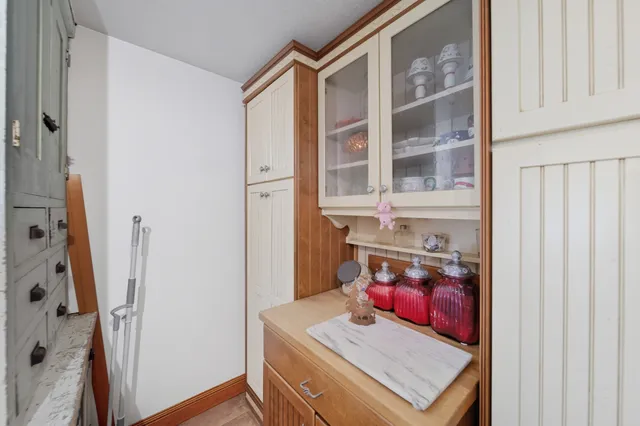 a work room with furniture and a window