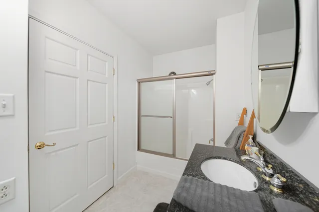 a view of a hallway with a chandelier