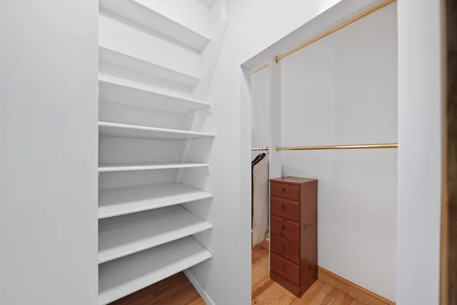 a view of a lake with a house in the background