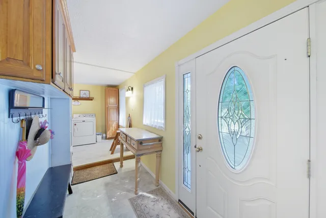 a view of a livingroom with furniture and workspace