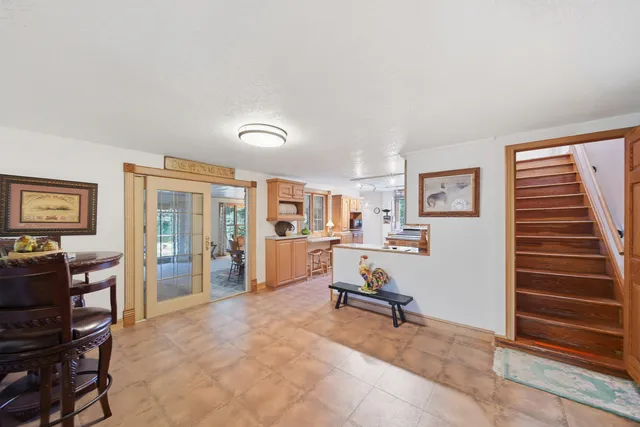 a kitchen with a refrigerator and a stove