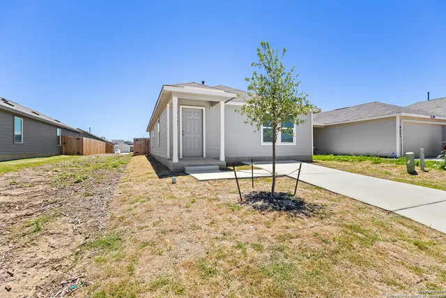 a house view with a backyard space