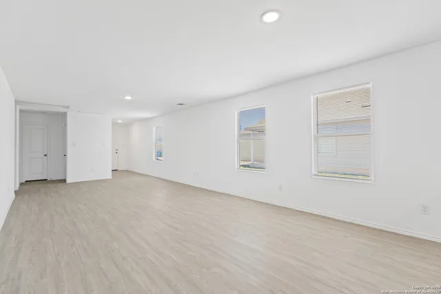 an empty room with windows