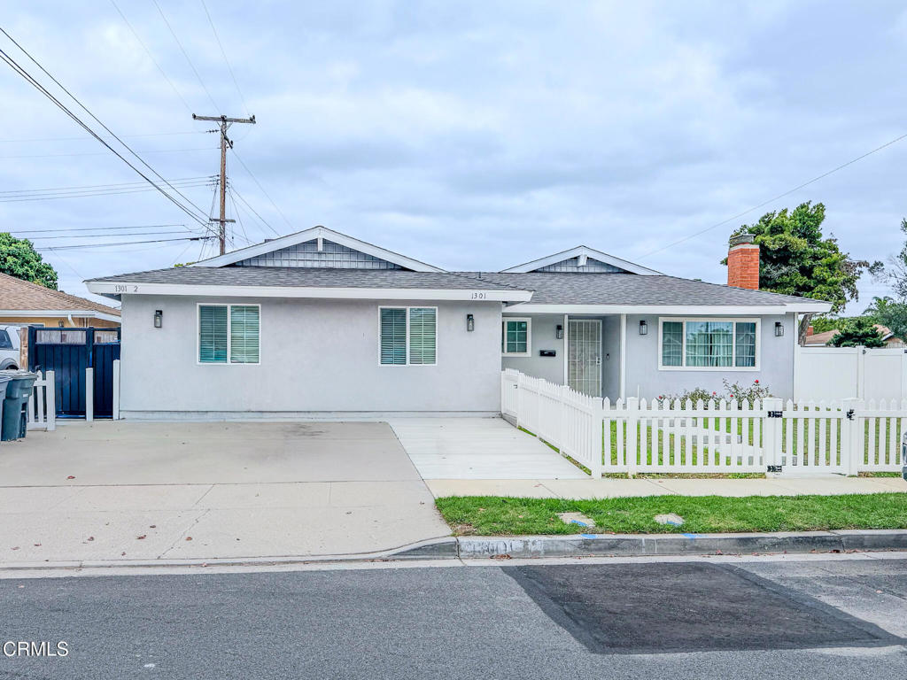 1301 Kingswood Way, Unit 2 Oxnard, CA 93030 - Photo 1 of 18 front view of a house with a yard