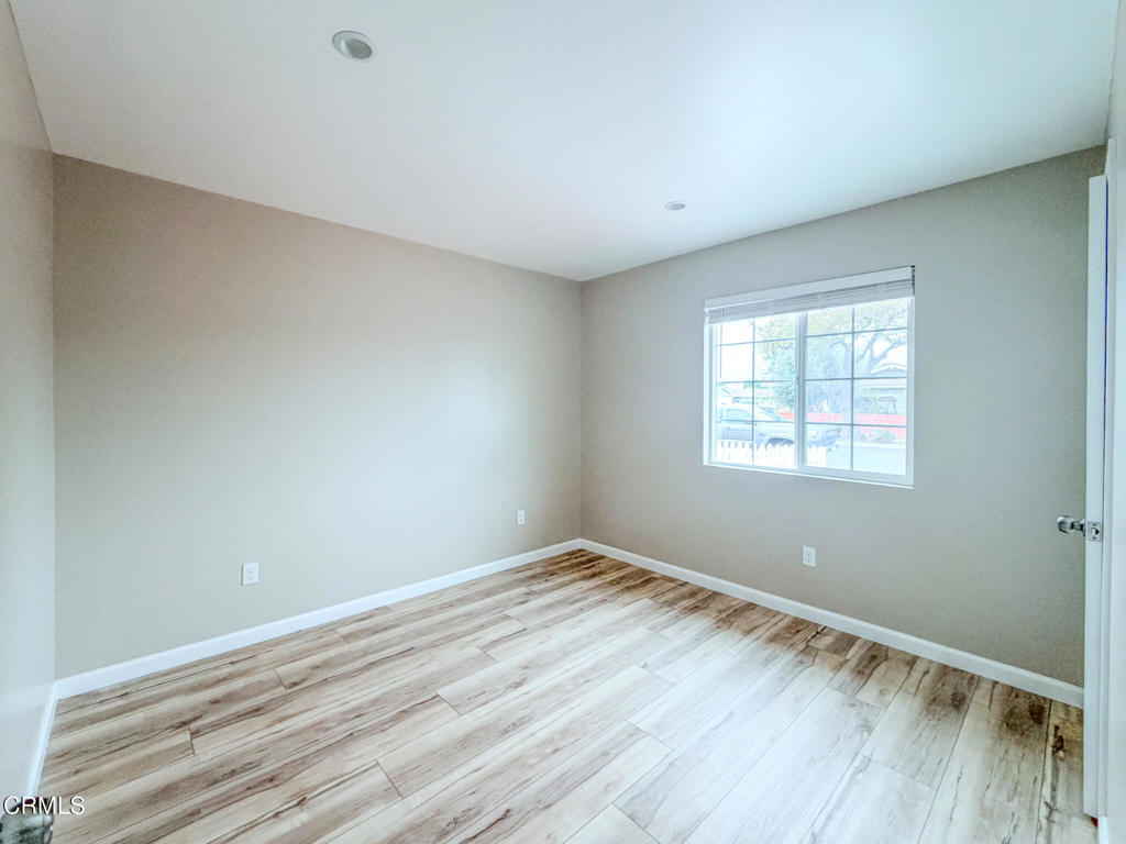 1301 Kingswood Way, Unit 2 Oxnard, CA 93030 - Photo 12 of 18 wooden floor in an empty room with a window
