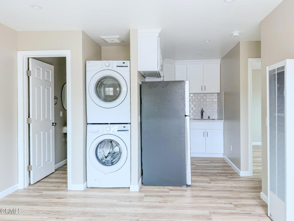 1301 Kingswood Way, Unit 2 Oxnard, CA 93030 - Photo 9 of 18 a utility room with sink dryer and washer