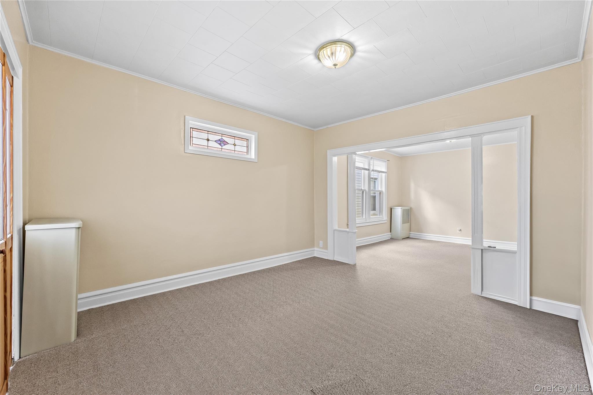 91-49 86th Street Queens, NY 11421 - Photo 18 of 42 an empty room with a empty space and window