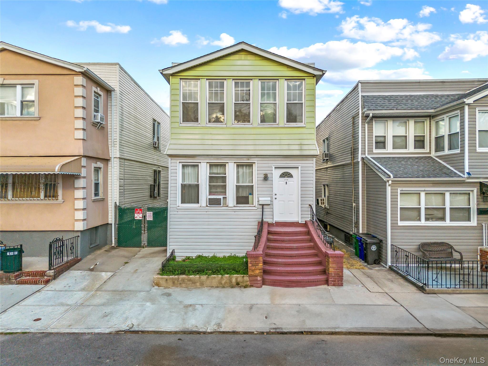 91-49 86th Street Queens, NY 11421 - Photo 2 of 42 a front view of a house