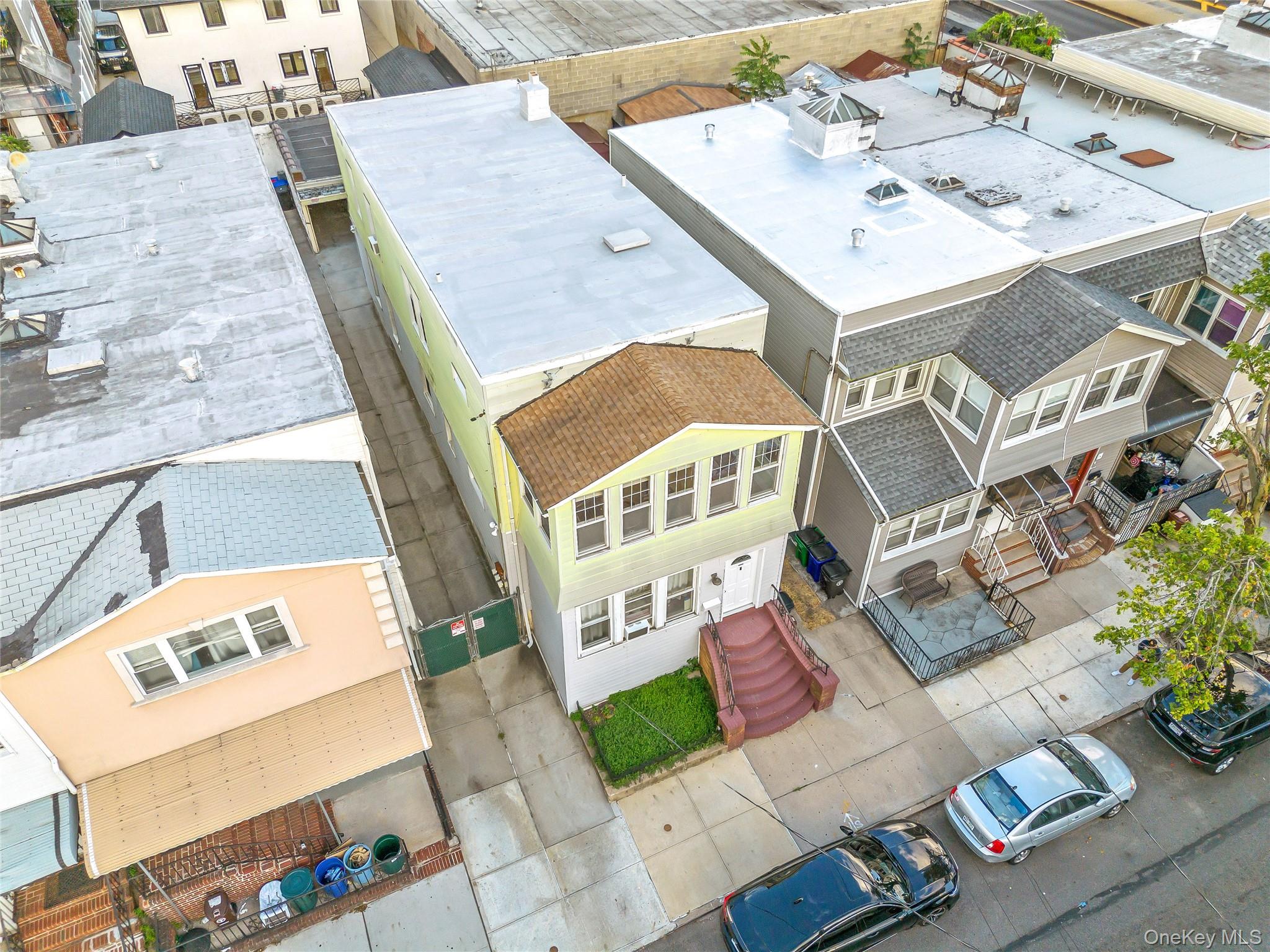 91-49 86th Street Queens, NY 11421 - Photo 38 of 42 an aerial view of a house with a yard