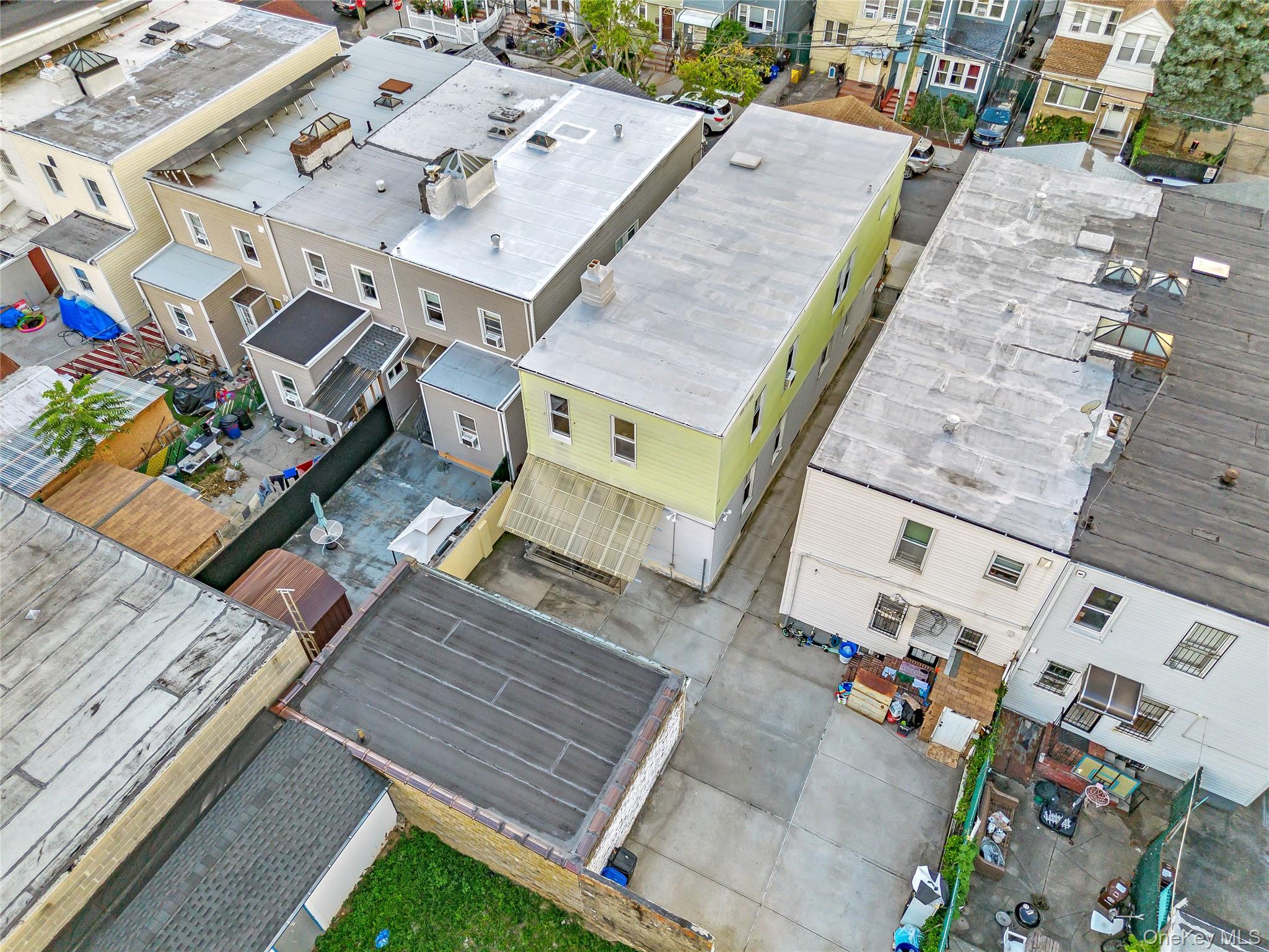 91-49 86th Street Queens, NY 11421 - Photo 40 of 42 an aerial view of a house with a garden