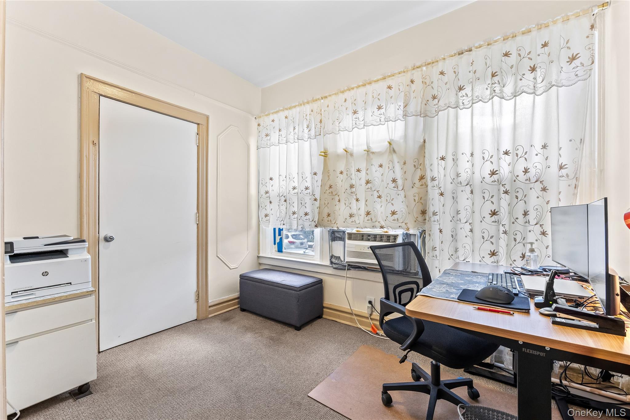 91-49 86th Street Queens, NY 11421 - Photo 7 of 42 a view of a workspace with furniture and a window