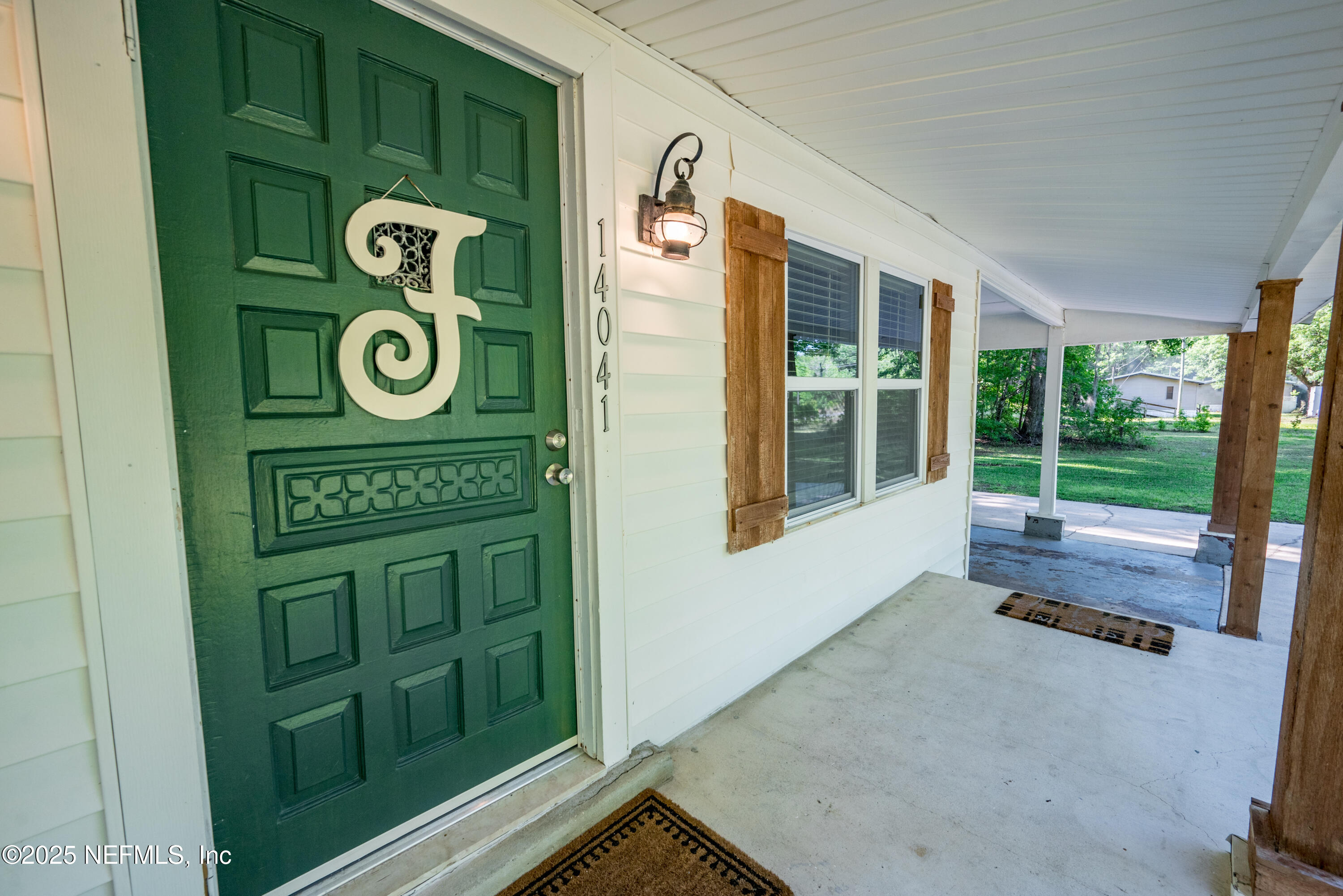 14041 Southeast 100a Road, Unit COUNTY Starke, FL 32091 - Photo 6 of 27 Front porch