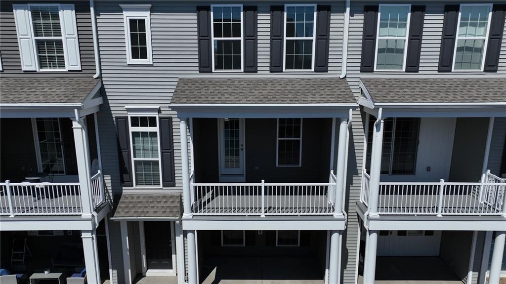 107 Gress Road Cranberry Township, PA 16066 - Photo 2 of 23 The covered porch just off the living room creates a seamless extension of the home’s living space, offering a perfect spot to relax and enjoy the outdoors. Accessible through a glass door, the porch is shaded and private, making it ideal for morning coffee, evening unwinding, or casual entertaining.