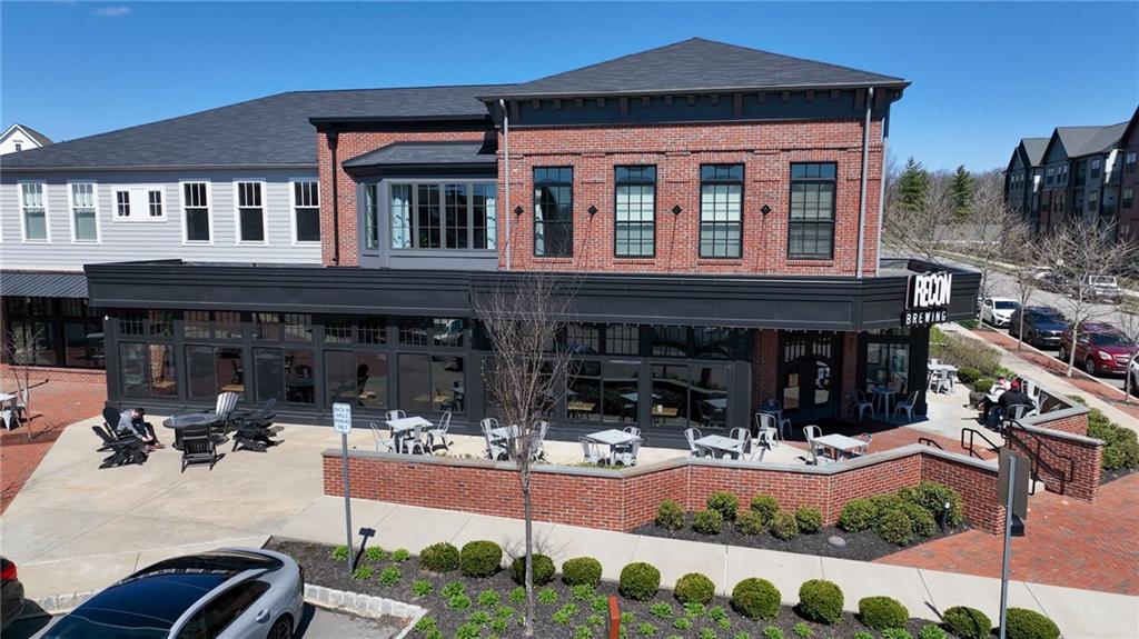 107 Gress Road Cranberry Township, PA 16066 - Photo 23 of 23 In the heart of the community, a collection of stylish retail storefronts and local amenities adds energy and convenience, placing dining, coffee shops, and everyday services just steps from home. Visible gathering spaces and pedestrian-friendly paths highlight a lifestyle built around connection and accessibility.