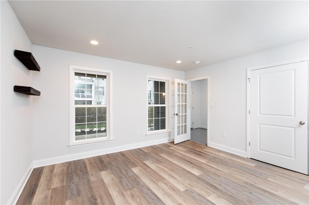 107 Gress Road Cranberry Township, PA 16066 - Photo 5 of 23 The lower-level family room is a bright, welcoming space that offers exceptional versatility and comfort. Large windows bring in natural light, creating an open and inviting atmosphere rarely found on a lower level. Recessed lighting enhances the room’s warmth.