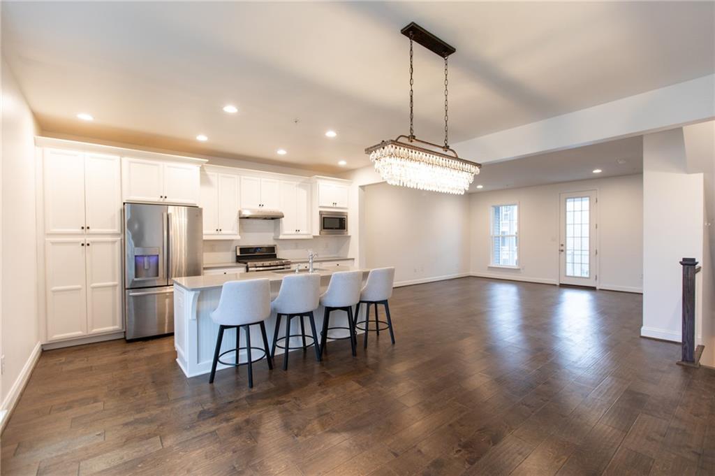 107 Gress Road Cranberry Township, PA 16066 - Photo 10 of 23 This open kitchen dining area is bright, spacious, and thoughtfully designed to bring everyone together. Positioned just off the kitchen, the dining space is framed by large windows that flood the area with natural light and offer pleasant neighborhood views.