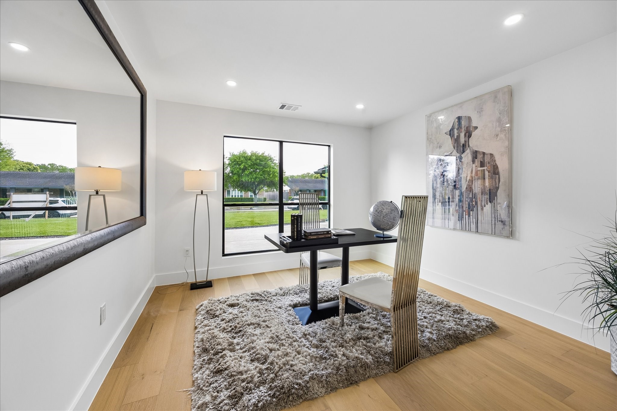 5430 Rutherglenn Drive Houston, TX 77096 - Photo 18 of 31 First floor bedroom features large windows with a contemporary design. An inviting space perfect for an office or study too.