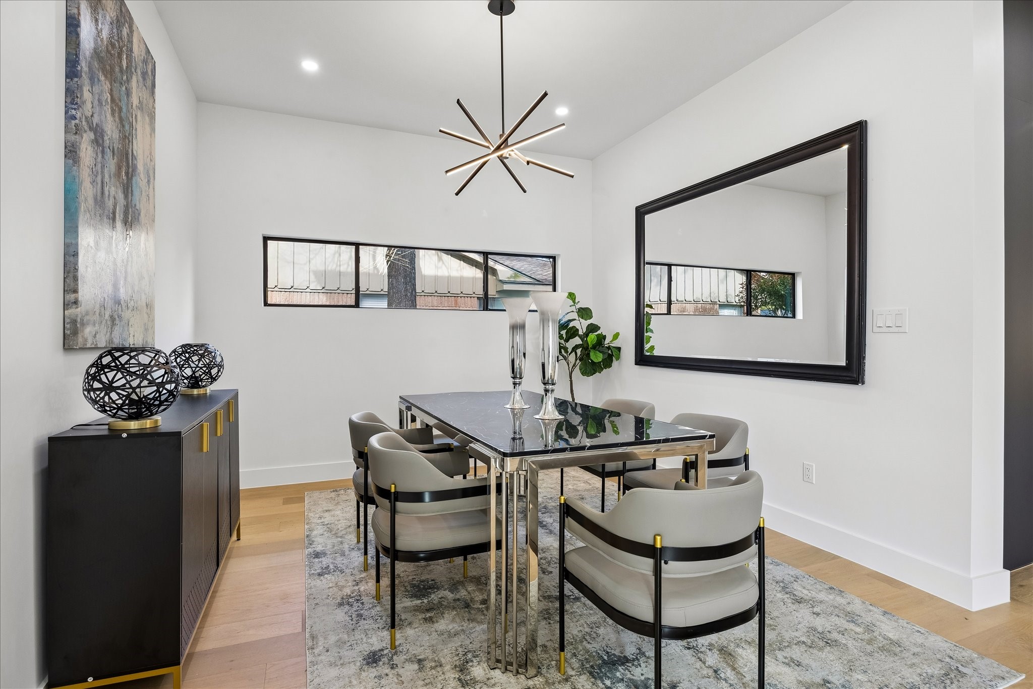 5430 Rutherglenn Drive Houston, TX 77096 - Photo 6 of 31 The dining room has a contemporary chandelier, tastefully placed windows creating an inviting atmosphere for those special dinners and holidays