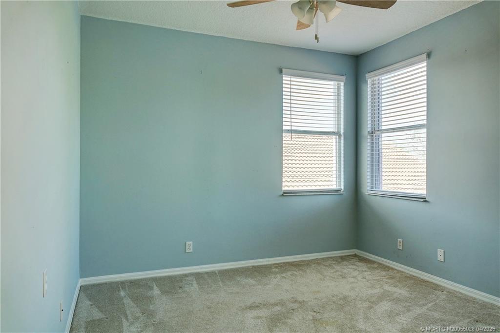 2120 Northwest Marsh Rabbit Lane Jensen Beach, FL 34957 - Photo 30 of 34 a view of an empty room with a window