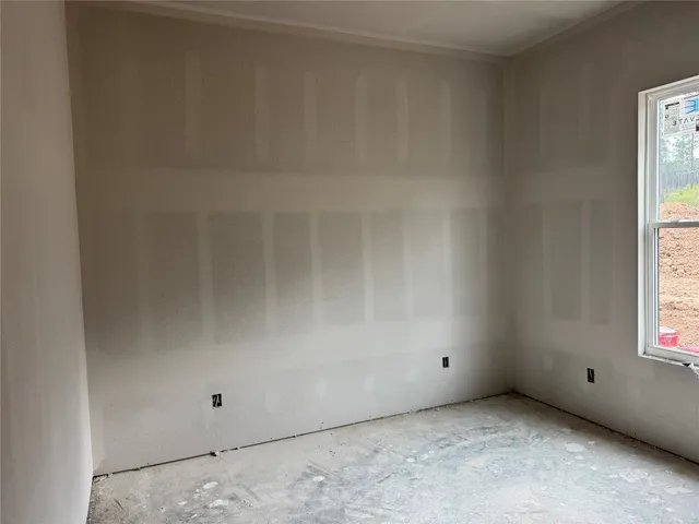a view of a porch with a table and chairs