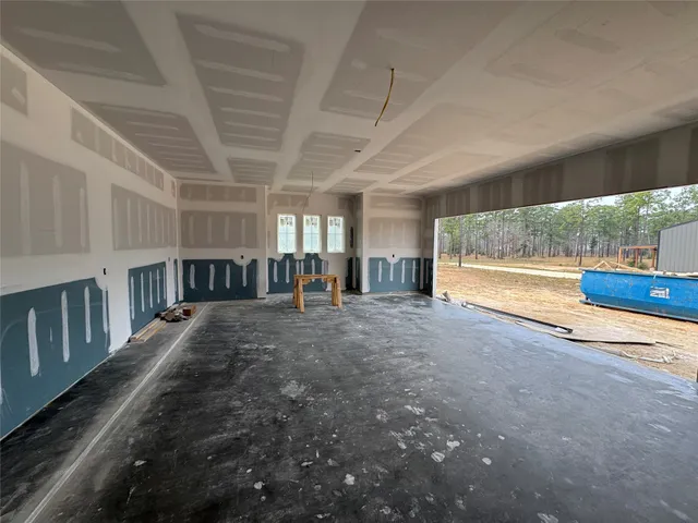 a view of empty room with windows