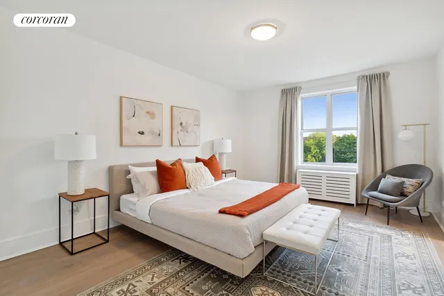 a bedroom with a bed and window