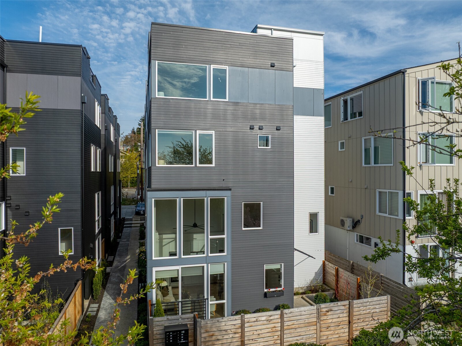 6320 41st Avenue Southwest, Unit A Seattle, WA 98136 - Photo 2 of 39 a front view of a building with a garden