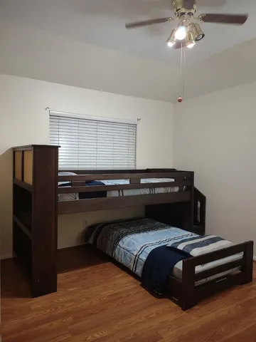 a bedroom with a bed and cabinets