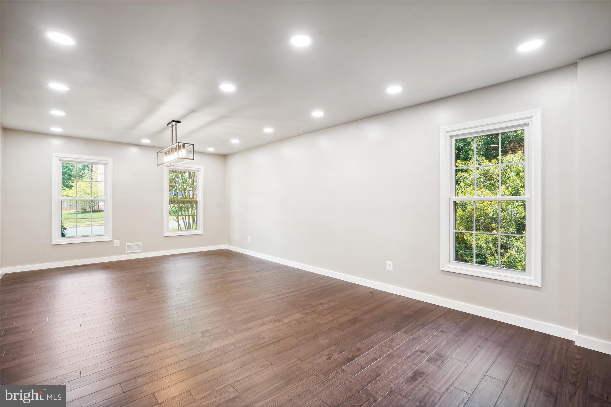 2613 Mountain Laurel Place Reston, VA 20191 - Photo 14 of 78 an empty room with wooden floor and windows