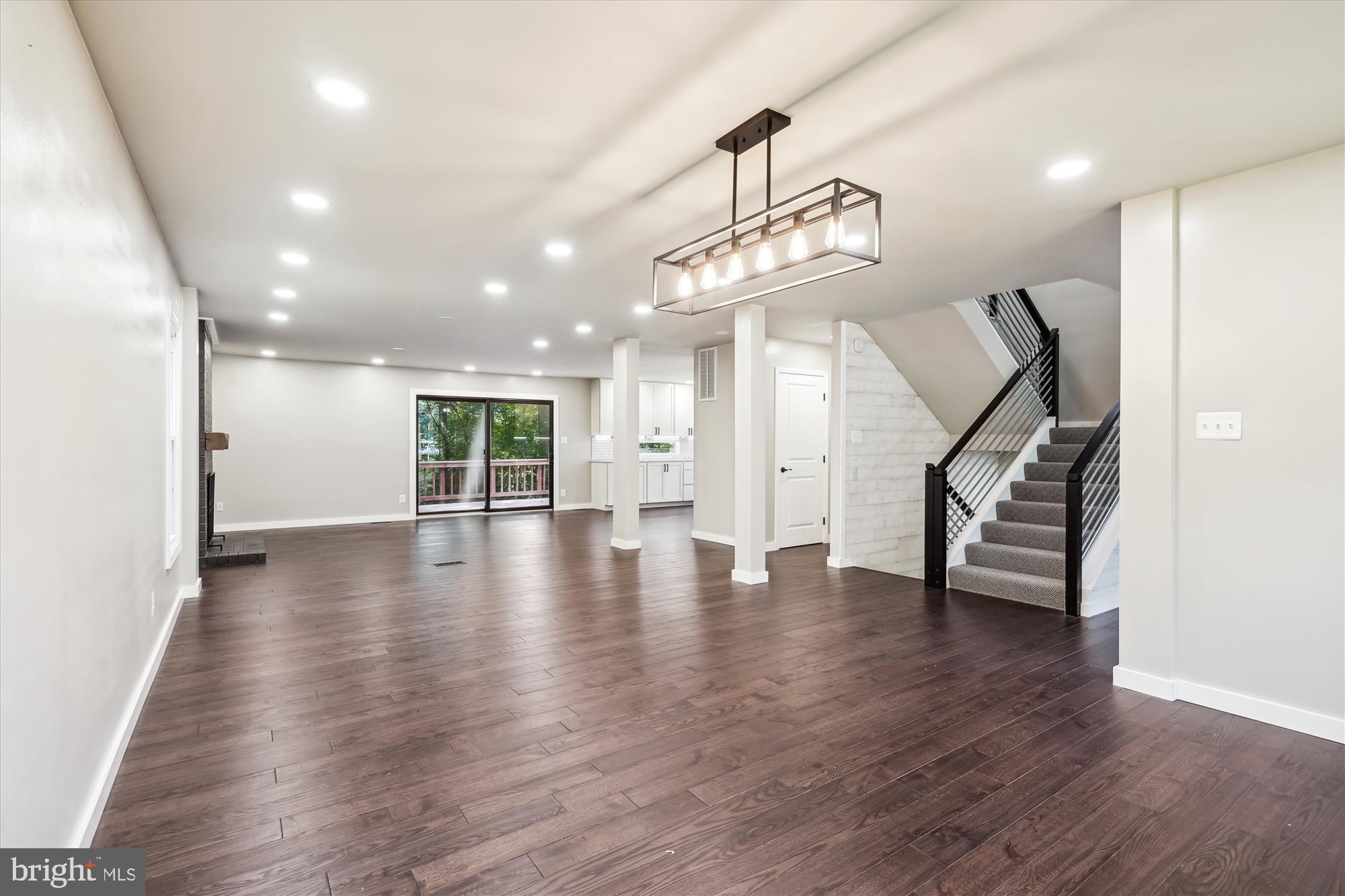2613 Mountain Laurel Place Reston, VA 20191 - Photo 16 of 78 a view of a room with wooden floors and stairs